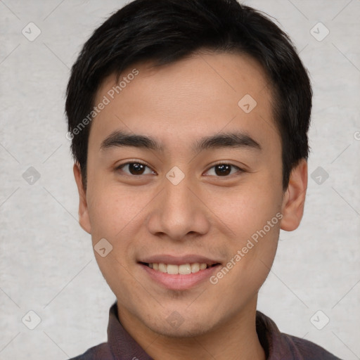 Joyful asian young-adult male with short  black hair and brown eyes