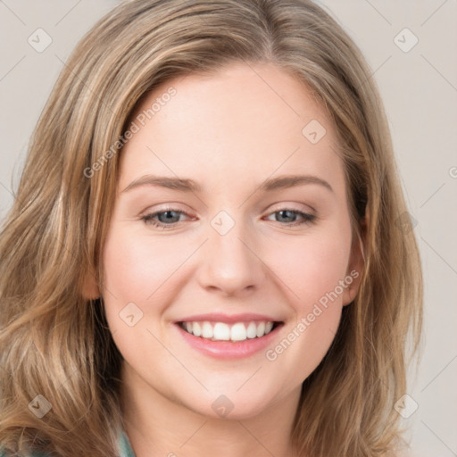 Joyful white young-adult female with long  brown hair and green eyes