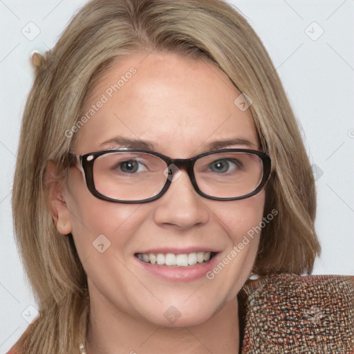 Joyful white adult female with medium  brown hair and blue eyes