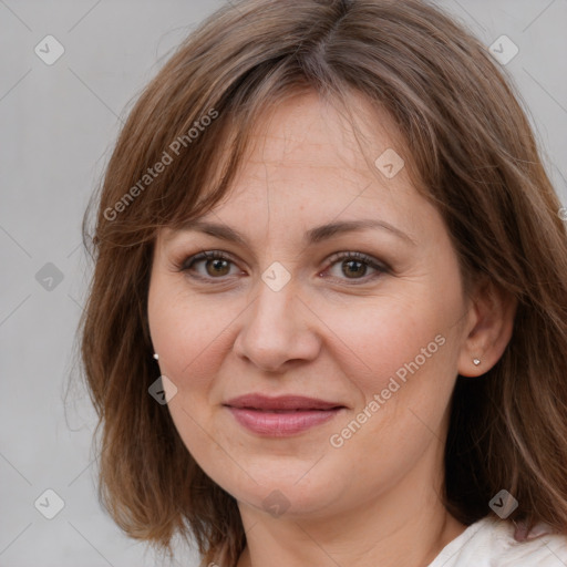 Joyful white adult female with medium  brown hair and grey eyes