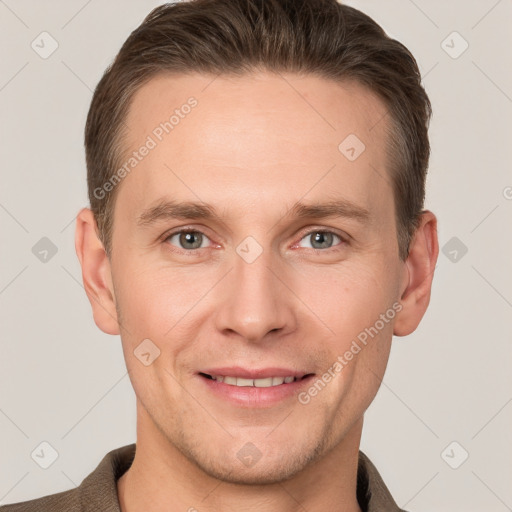 Joyful white adult male with short  brown hair and grey eyes