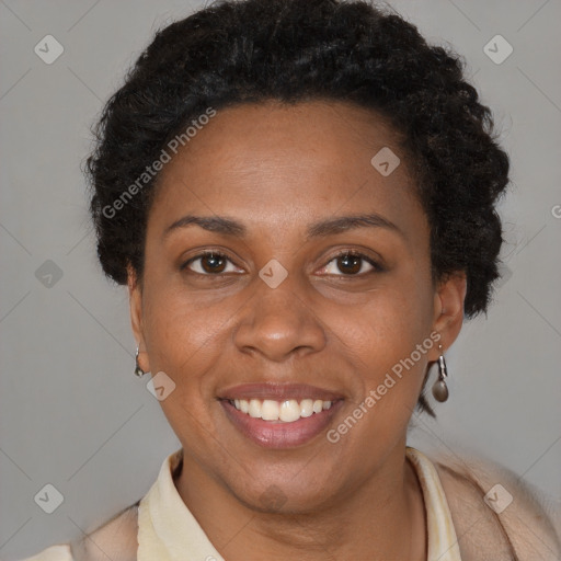 Joyful black adult female with short  brown hair and brown eyes