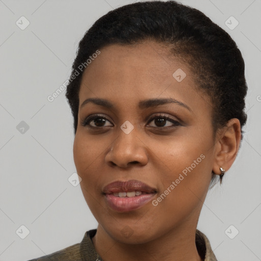 Joyful black young-adult female with short  brown hair and brown eyes