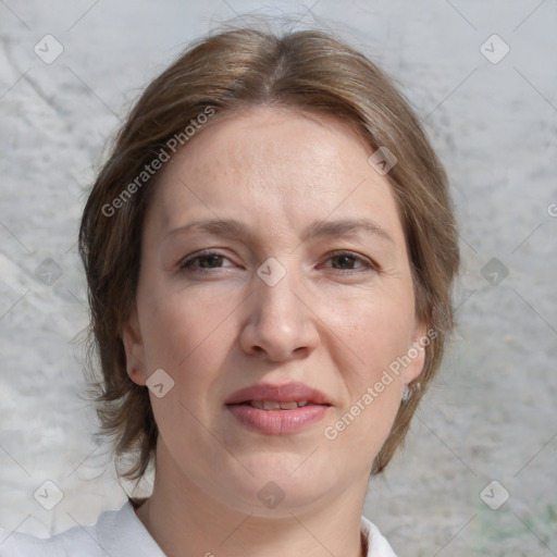 Joyful white adult female with medium  brown hair and blue eyes