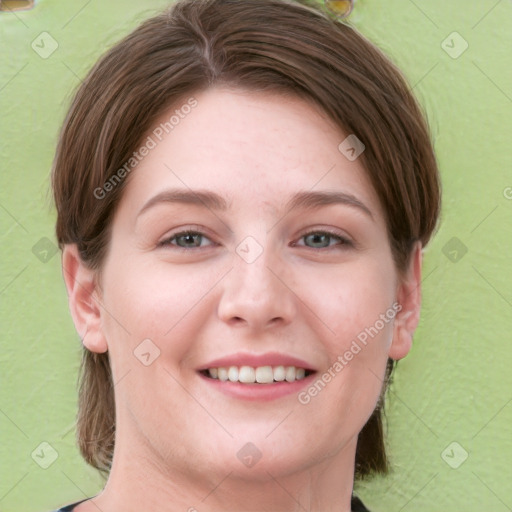 Joyful white young-adult female with medium  brown hair and green eyes