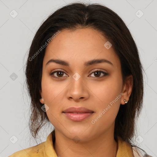 Joyful latino young-adult female with medium  brown hair and brown eyes