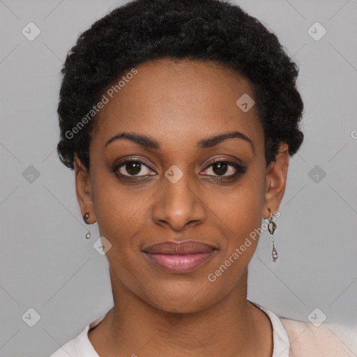 Joyful black young-adult female with short  black hair and brown eyes