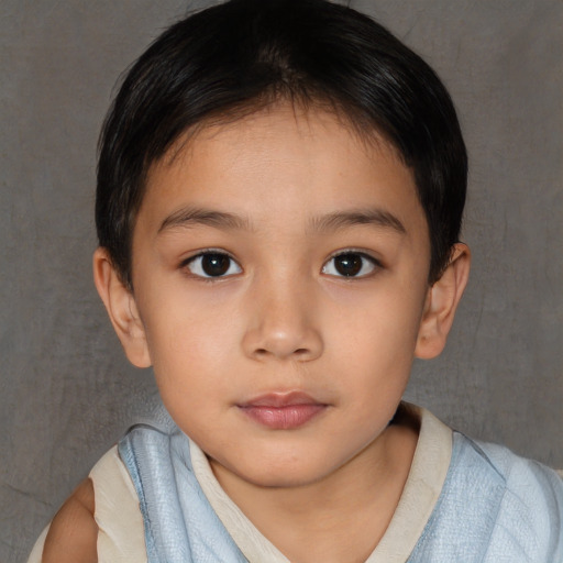 Joyful asian child female with short  brown hair and brown eyes