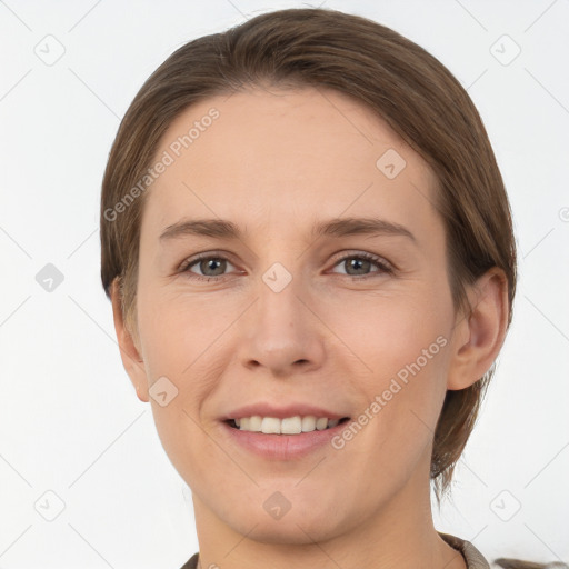 Joyful white young-adult female with short  brown hair and grey eyes