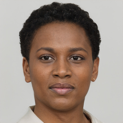 Joyful black young-adult female with short  brown hair and brown eyes