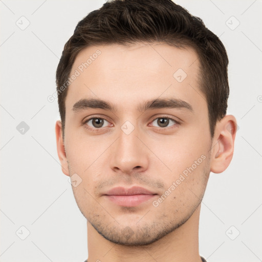 Neutral white young-adult male with short  brown hair and brown eyes