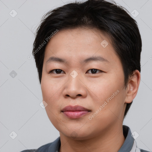 Joyful asian young-adult female with short  brown hair and brown eyes