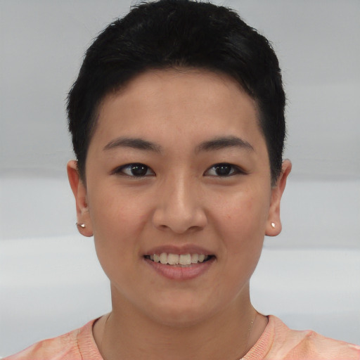 Joyful asian young-adult female with short  black hair and brown eyes