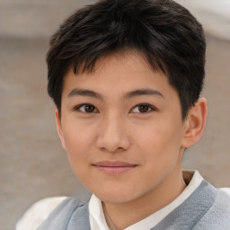 Joyful asian child female with short  brown hair and brown eyes