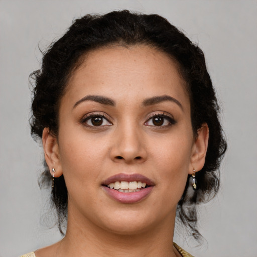 Joyful latino young-adult female with medium  brown hair and brown eyes