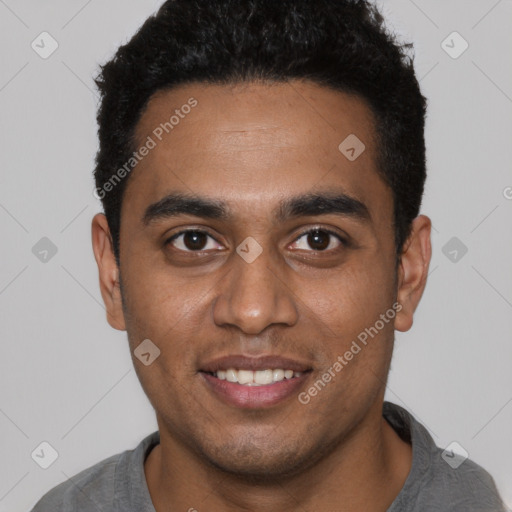 Joyful black young-adult male with short  black hair and brown eyes