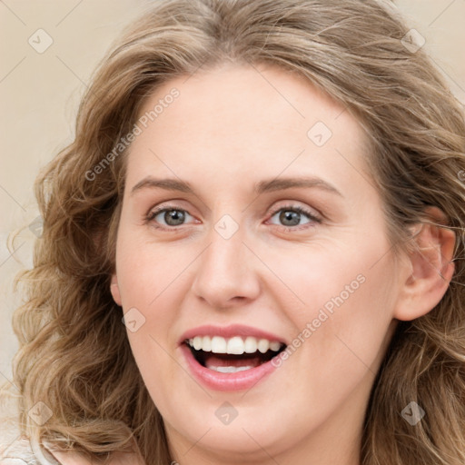 Joyful white young-adult female with long  brown hair and blue eyes