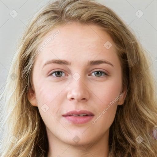 Joyful white young-adult female with long  brown hair and blue eyes