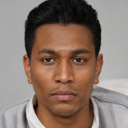 Neutral latino young-adult male with short  black hair and brown eyes