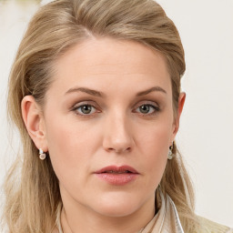 Joyful white young-adult female with long  brown hair and blue eyes