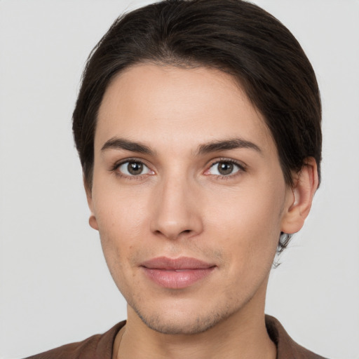 Joyful white young-adult female with short  brown hair and brown eyes