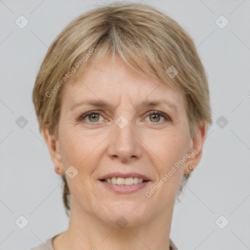 Joyful white adult female with medium  brown hair and grey eyes