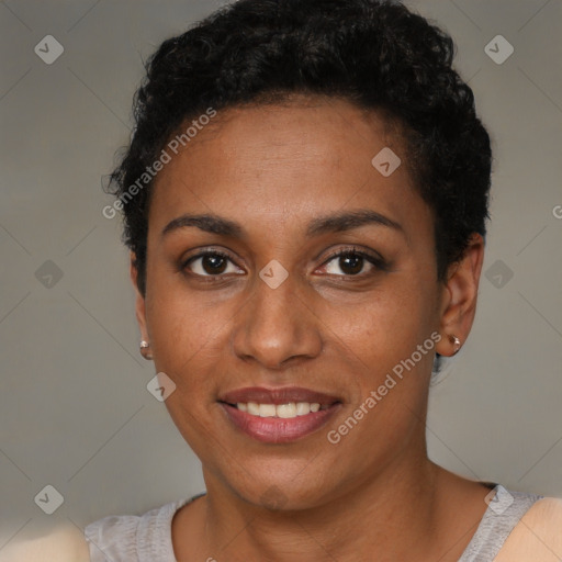 Joyful black young-adult female with short  brown hair and brown eyes