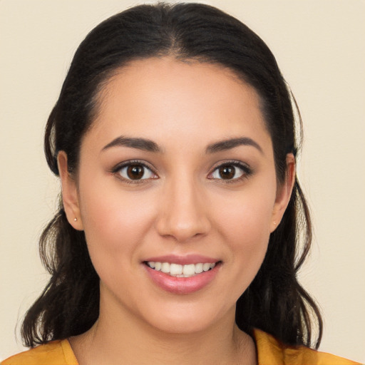 Joyful white young-adult female with long  brown hair and brown eyes