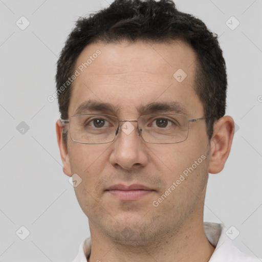 Joyful white adult male with short  brown hair and brown eyes