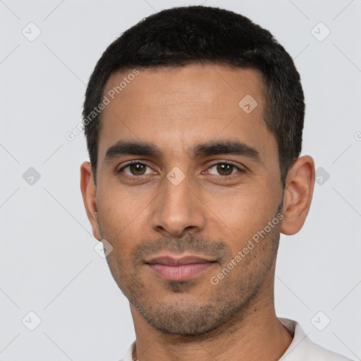 Neutral latino young-adult male with short  black hair and brown eyes