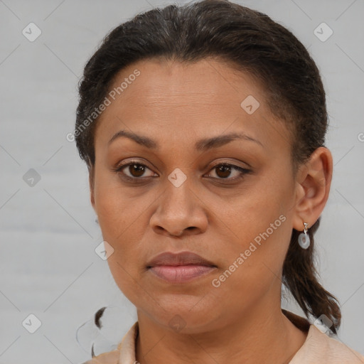 Joyful black adult female with short  brown hair and brown eyes