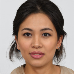 Joyful asian young-adult female with medium  brown hair and brown eyes