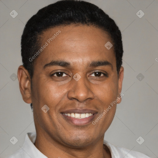 Joyful latino young-adult male with short  black hair and brown eyes