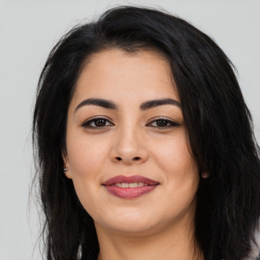 Joyful asian young-adult female with long  black hair and brown eyes