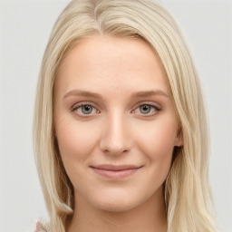 Joyful white young-adult female with long  brown hair and blue eyes