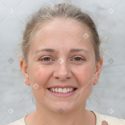 Joyful white adult female with short  brown hair and brown eyes