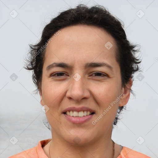 Joyful white adult female with short  brown hair and brown eyes