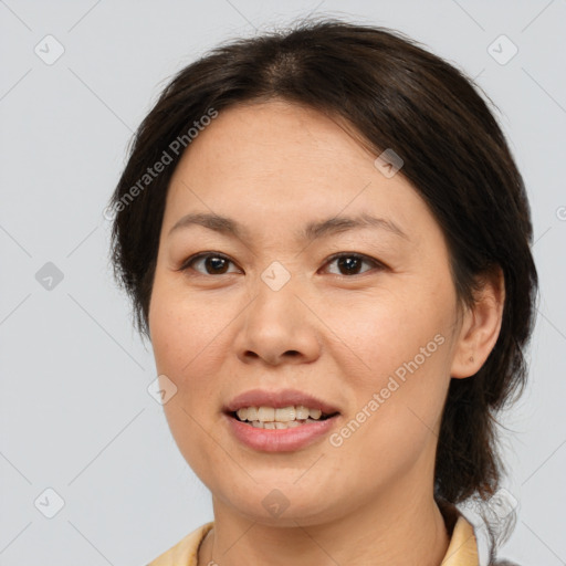 Joyful white adult female with medium  brown hair and brown eyes