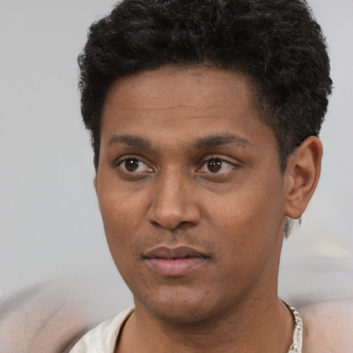 Neutral black young-adult male with short  brown hair and brown eyes