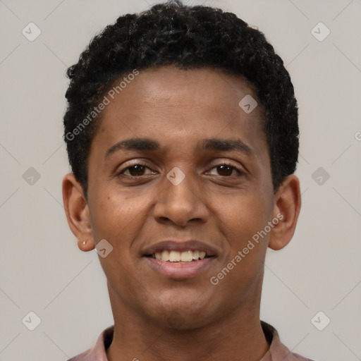 Joyful black young-adult male with short  black hair and brown eyes