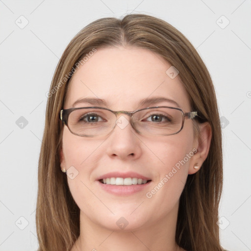 Joyful white young-adult female with long  brown hair and grey eyes