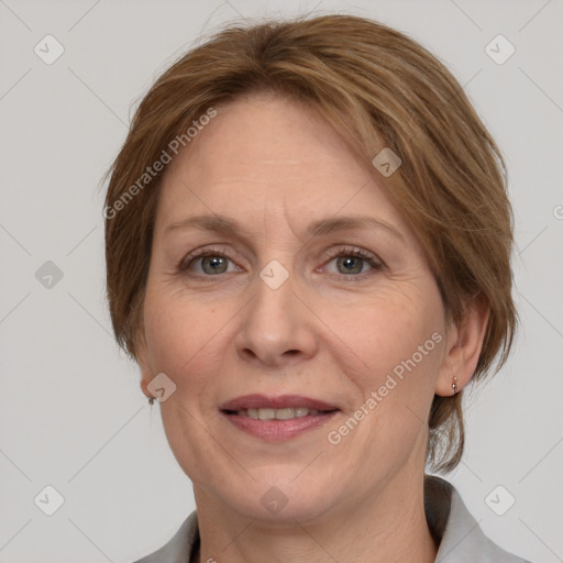 Joyful white adult female with medium  brown hair and grey eyes