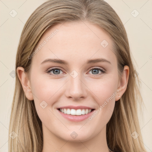 Joyful white young-adult female with long  brown hair and blue eyes