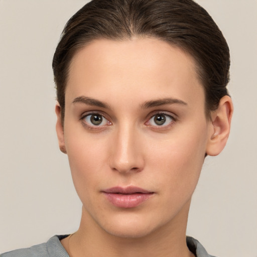 Neutral white young-adult female with short  brown hair and brown eyes