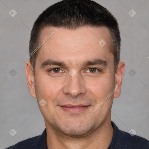 Joyful white adult male with short  brown hair and brown eyes