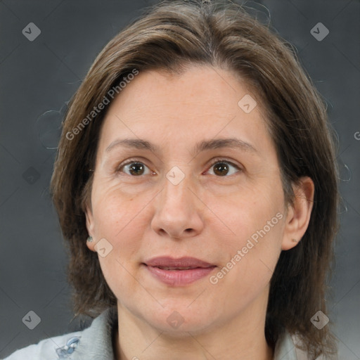 Joyful white adult female with medium  brown hair and brown eyes