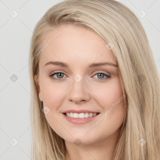 Joyful white young-adult female with long  brown hair and blue eyes