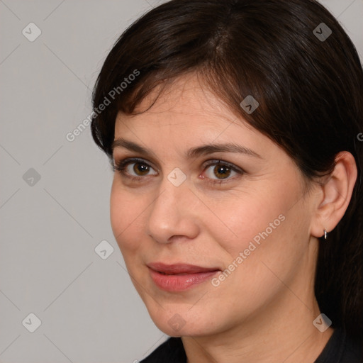 Joyful white adult female with medium  brown hair and brown eyes