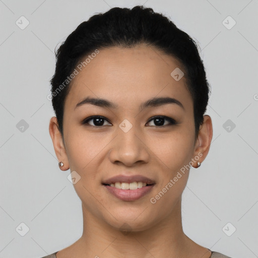 Joyful latino young-adult female with short  black hair and brown eyes