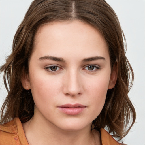 Neutral white young-adult female with long  brown hair and brown eyes